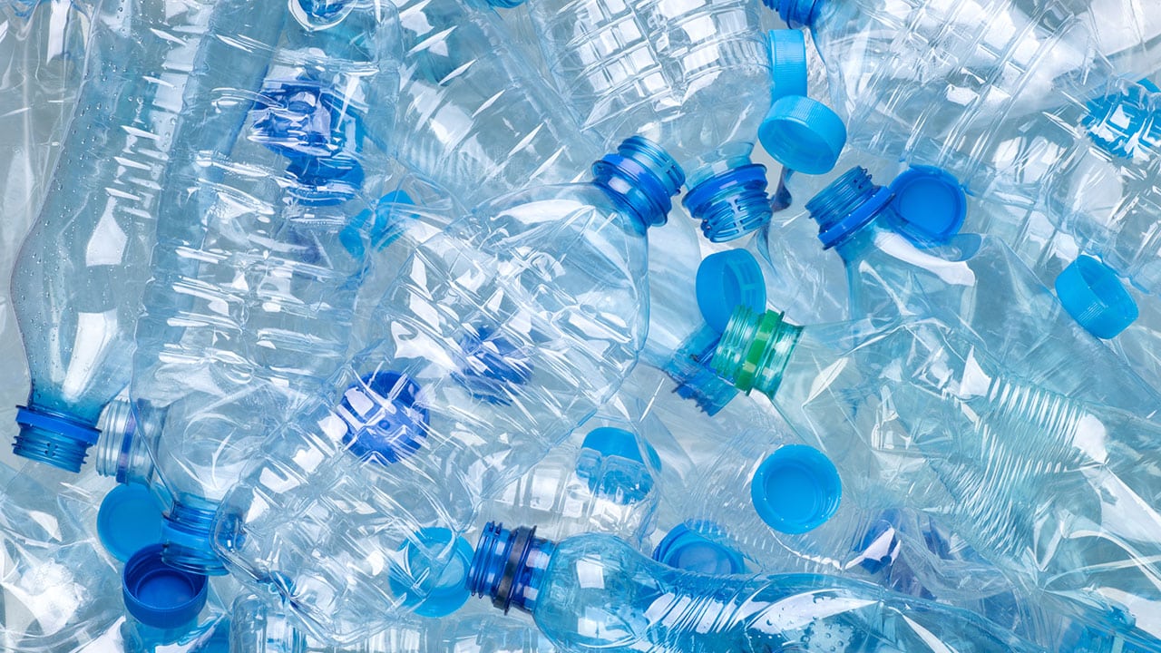 Many empty plastic water bottles lying together